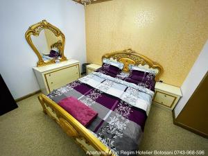 a bedroom with a bed and a mirror at Apartament De Lux zona 0 Botosani 2 camere in Botoşani