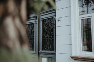 a pair of wrought iron doors on a building at Urbino Casa in Cluj-Napoca