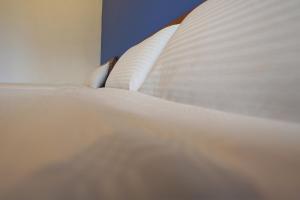 En eller flere senge i et værelse på Taitung city-cottage B&B