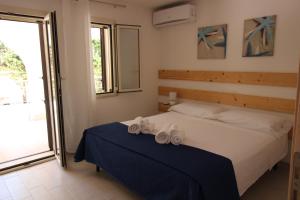Postel nebo postele na pokoji v ubytování Anthiros Affitti brevi