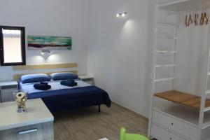 Postel nebo postele na pokoji v ubytování Anthiros Affitti brevi