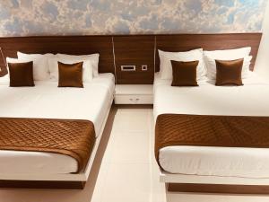 Ένα ή περισσότερα κρεβάτια σε δωμάτιο στο Nandha Grande