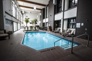 a swimming pool in the middle of a building at Old Stone Inn Boutique Hotel in Niagara Falls