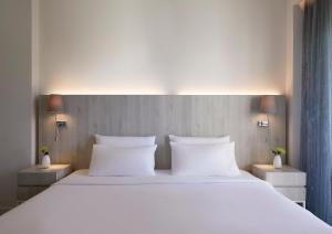 Letto o letti in una camera di Amus Hotel & Spa