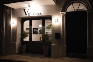 a front door of a restaurant at night at Victoria by Petit Chic in Mellieħa