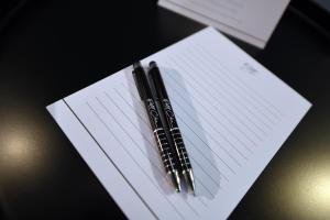 two pens sitting on top of a piece of paper at Victoria by Petit Chic in Mellieħa