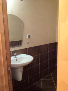 a bathroom with a sink and a mirror at Elite Apartments is located in the old town of Pomorie in Pomorie