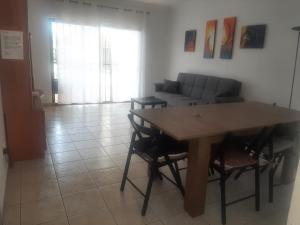 a living room with a table and a couch at Fantastic 3 Bedrooms MAREVERDE, WIFI free in Adeje