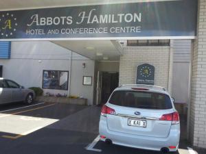 a car parked in front of a hotel and conference centre at Abbots Hamilton – Hotel and Conference Centre in Hamilton