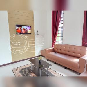 Χώρος καθιστικού στο NQ Jelawat HOMESTAY