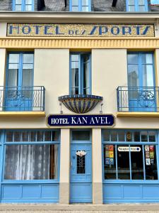 a hotel in the city of paris with blue doors at HOTEL KAN AVEL in Saint-Lunaire