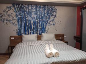 Postel nebo postele na pokoji v ubytování Nangnon Hill Hug Hotel