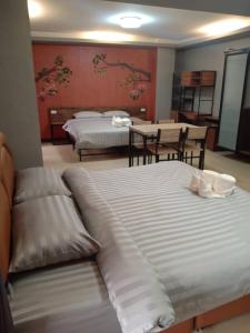 Postel nebo postele na pokoji v ubytování Nangnon Hill Hug Hotel