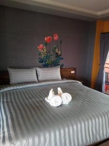 Postel nebo postele na pokoji v ubytování Nangnon Hill Hug Hotel
