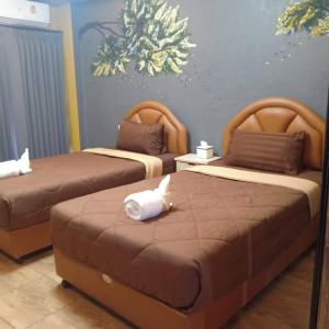 Postel nebo postele na pokoji v ubytování Nangnon Hill Hug Hotel