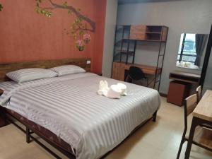 Postel nebo postele na pokoji v ubytování Nangnon Hill Hug Hotel
