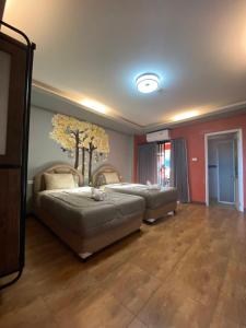 Postel nebo postele na pokoji v ubytování Nangnon Hill Hug Hotel