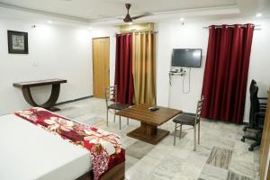 a living room with a couch and a table at Shanti Residency in New Delhi