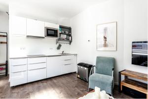 Kuchyň nebo kuchyňský kout v ubytování Studio en deluxe appartement Blueberry
