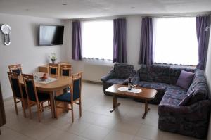 a living room with a couch and a table at Haus Claudia in Nauders