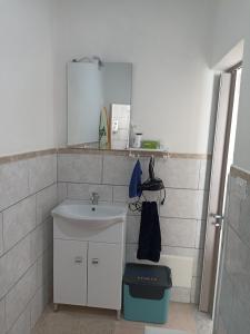 a bathroom with a sink and a mirror at Fichi d india in Cellino San Marco +27 photos