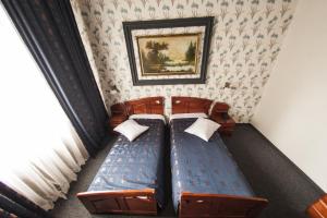 Postel nebo postele na pokoji v ubytování Bucharest Comfort Suites Hotel