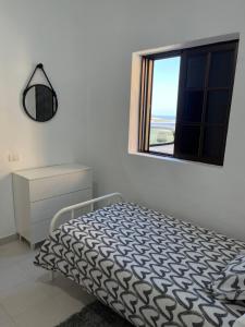 Łóżko lub łóżka w pokoju w obiekcie Low Island House