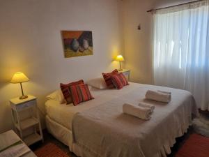 a bedroom with two beds with towels on them at Finca La Vertiente in El Encón