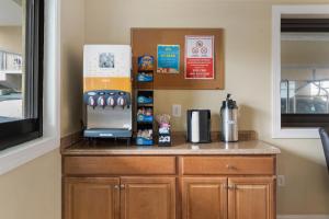 a kitchen with a counter with a kitchen appliance on it at Coastal Palms Inn and Suites in Ocean City