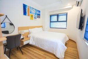 A bed or beds in a room at Căn hộ 2 phòng ngủ trực biển Quy Nhơn, TMS Pullman căn góc
