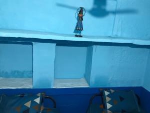 a figurine of a woman standing on top of a boat at Blue Stay Jodhpur in Jodhpur