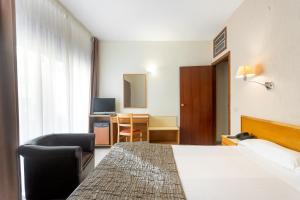 Postel nebo postele na pokoji v ubytování Hotel Leuka