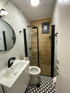 a bathroom with a shower and a toilet and a sink at Levis house Eilat in Eilat