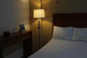 Postel nebo postele na pokoji v ubytování Hotel Marllou