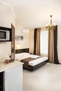 Кровать или кровати в номере Flatlux Apartments