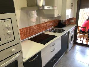 A kitchen or kitchenette at AVA-2