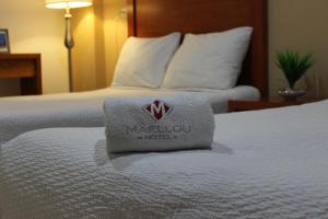 Postel nebo postele na pokoji v ubytování Hotel Marllou
