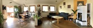 a living room with a couch and a table at Astegg, Apart in Finkenberg