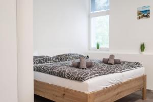 Łóżko lub łóżka w pokoju w obiekcie Apartmány U Jiříka