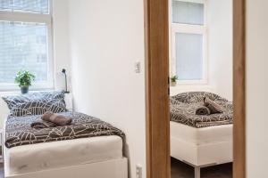 Łóżko lub łóżka w pokoju w obiekcie Apartmány U Jiříka