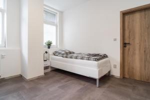 Postel nebo postele na pokoji v ubytování Apartmány U Jiříka