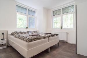 Łóżko lub łóżka w pokoju w obiekcie Apartmány U Jiříka