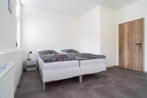 Łóżko lub łóżka w pokoju w obiekcie Apartmány U Jiříka