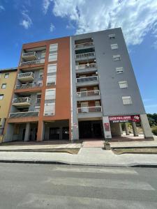 a large apartment building on the side of a street at Timpa House Alle Pendici Dell'Etna in Paterno