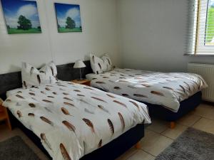 En eller flere senge i et værelse på inlimburgopvakantie