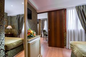 A bed or beds in a room at Ca' Marinella