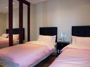 Posteľ alebo postele v izbe v ubytovaní Apartment 4p Beach 3 Pools Top Location Garden SPA Parking Shops + 37 fotografií