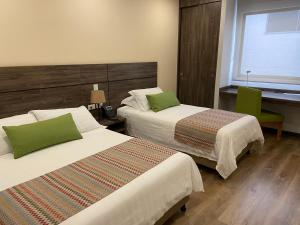 Postelja oz. postelje v sobi nastanitve EcoHub Hotel Medellin