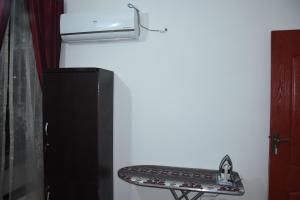 a shelf in the corner of a kitchen with a stove at HYATT ARYANA Guesthouse 1 in Islamabad