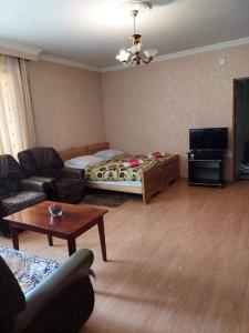 A seating area at Family Apartment in Mestia